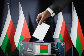 Madagascar flags, hand dropping ballot card into a box - voting, election concept - 3D illustration