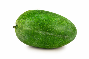 Unpeeled mango fruit with green mottled peel in water droplets
