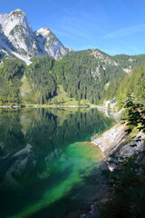 Fototapeta na wymiar Reflections on the Vorderer Gosausee (lower lake), Salzkammergut, Styria, Austria, Europe