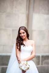 Fashion bride white wedding dress in the old city