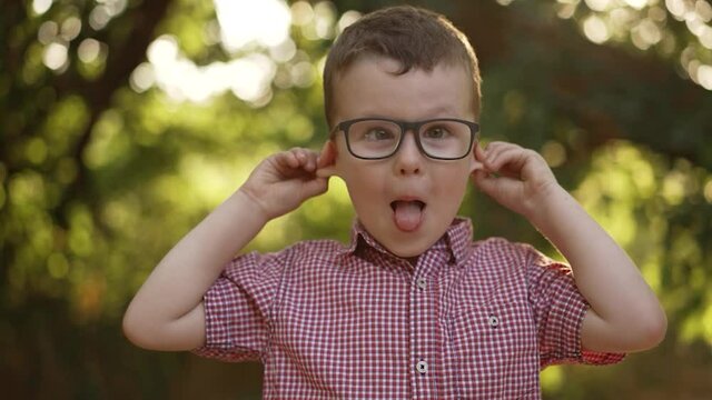 Happy boy making funny faces