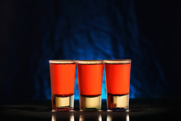 Fototapeta premium three glasses with red alcohol
