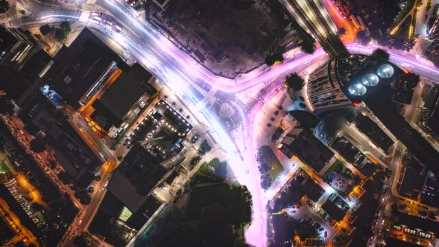Top down hyperlapse of traffic light trails on night city streets - 3d animation
