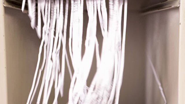 Detail of a paper shredder machine. Shredding paper