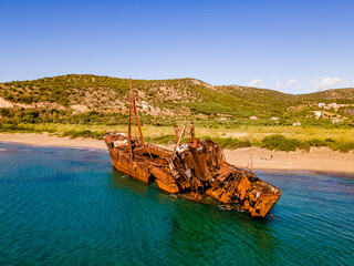 Stranded fishing ship on a greek beach, drone photo