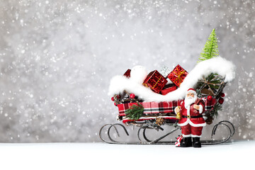 Christmas or New Year banner. Santa Claus and sleigh with Christmas gifts. Festive decorations and presents for winter holidays, copy space
