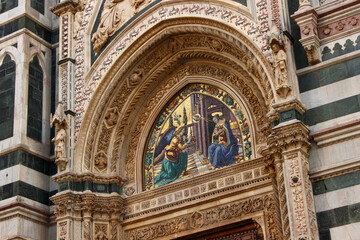 Fototapeta na wymiar Presco painting above the side entrance door of the Cathedral of Florence (Duomo di Firenze) , Tuscany, Italy