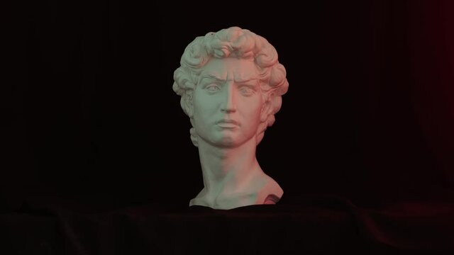 plaster bust of david with colored light