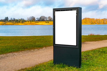 Large blank billboard on a park