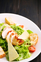 Caesar salad close up. chicken caesar salad with parmesan cheese