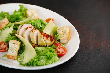 Caesar salad close up. chicken caesar salad with parmesan cheese