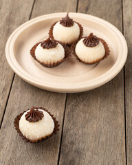 Typical gourmet brazilian brigadeiros, various flavors over wooden table