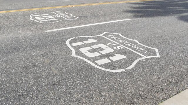 Pacific ocean Coast Highway road marking on asphalt, historic route 101, California State Route 1 roadtrip. Iconic emblem sign on freeway with dividing line in Oceanside, USA. Scenic road trip signage