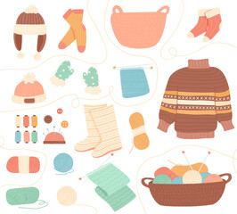 Winter knit clothes. Knitting hobby, wool cloth cardigan sweater. Bundle of knitted winter clothes and outerwear isolated on light background