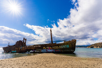 Stranded fishing ship on a greek beach,