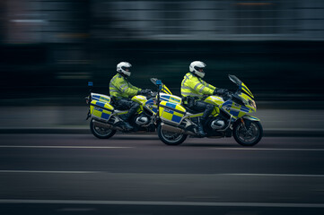 British Motorcycle police in Motion from the side