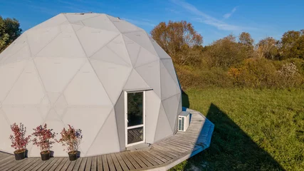 Foto op Canvas Gorgeous dome home of the future. Green Design, Innovation, Architecture. A spherical test building outside. © kalyanby