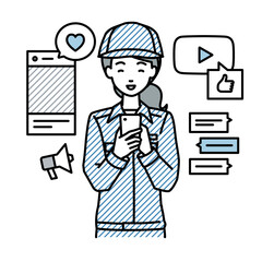 立ってスマートフォンでさまざまなSNSで楽しく交流する作業員の女性