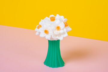 Flower handmade soap on a pink yellow background with copy space. Homemade soap on a colored background