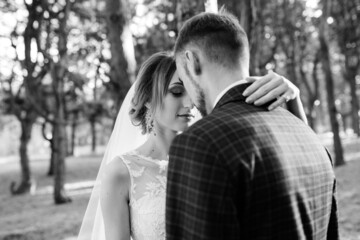 walk of the bride and groom through the autumn forest