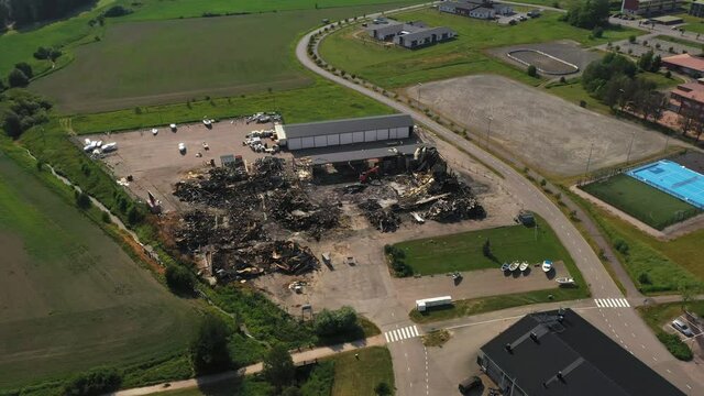 Aerial view over a structure distroyed by natural powers - orbit, drone shot