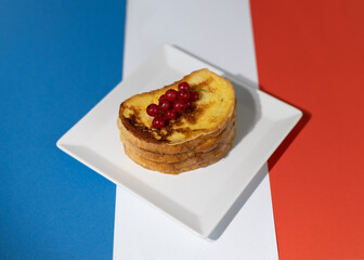 Traditional French toast with figs and red currants. Fried bread soaked in a mixture of milk, eggs and sugar.