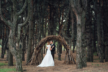 walk of the bride and groom through the autumn forest