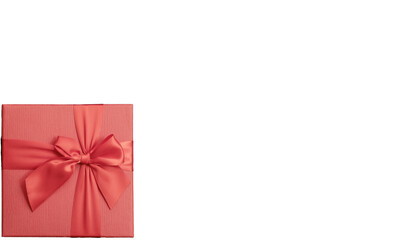 Red box with a bow in the bottom corner on an isolated background. Top view. A holiday gift. Card