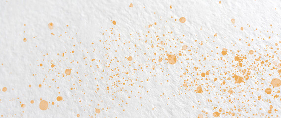 Fototapeta na wymiar Drops of orange paint on watercolor paper. Abstract texture. Abstract background. 