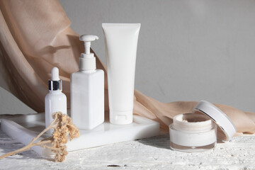 white wood table background with fabric textile, cosmetic makeup bottle lotion cream product with beauty fashion skincare healthcare mockup