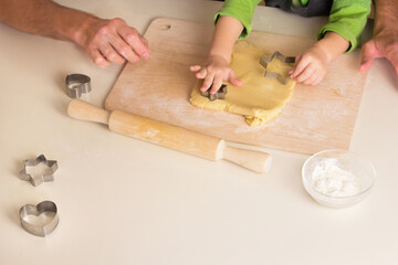 Kid cooking class together with father. Handmade Christmas dessert. Family Making cookie, Hands using rolling pin