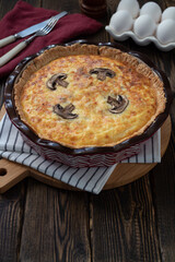 quiche with chicken and mushrooms in rustic style
