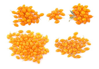 Set with fresh ripe sea buckthorn berries on white background, top view