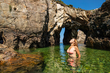 Woman breathing fresh air in a exotic beach