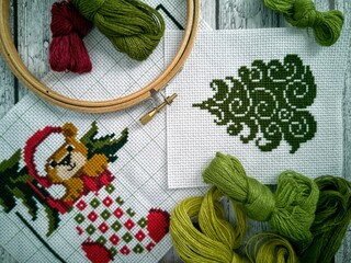 christmas cross-stitch embroidery and woolen threads 