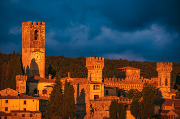 the towers of Badia a Passignano in a fiery sunset