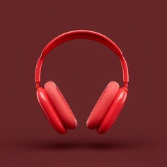 Monochrome red color over ear headphone in a red studio, front view, 3d rendering