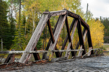 Wood beams of old wooden bridge in forest