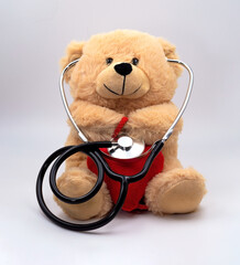 Teddy bear with midsection device stethoscope and heart