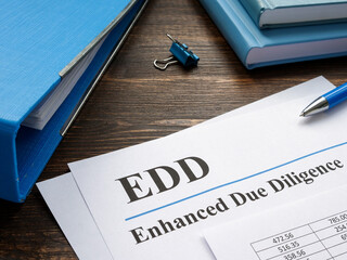EDD enhanced due diligence papers and blue folder. - obrazy, fototapety, plakaty