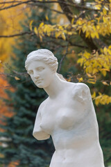 Antique sculptural composition with a woman and a column