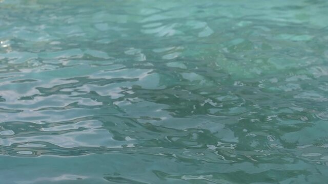 Slow motion footage of swimming pool water surface