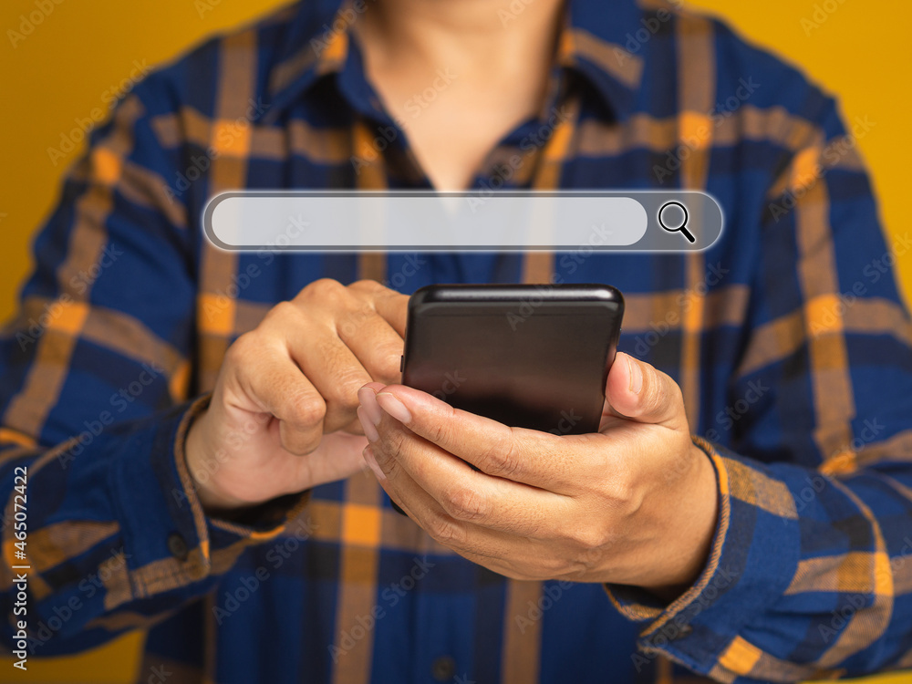 Poster search engine online concept. close-up of hand a man in blue shirt using smartphone search for infor