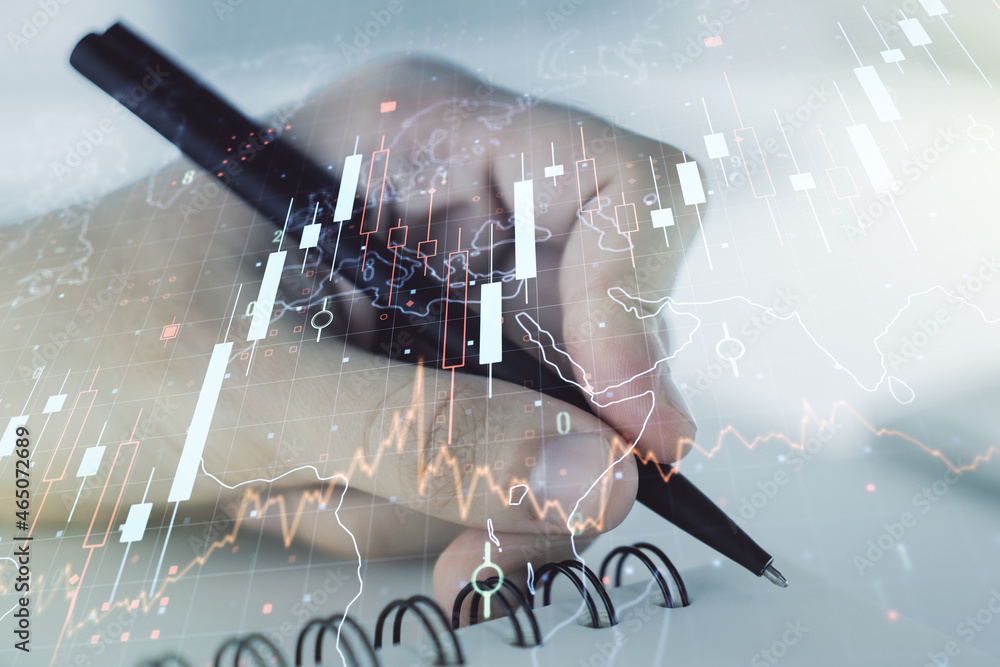 Poster Multi exposure of abstract financial diagram with world map and with man hand writing in notepad on background, banking and accounting concept