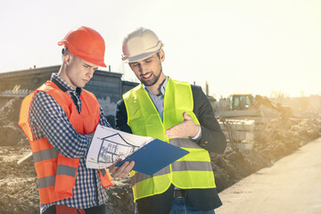 Construction Supervisor Supervises the pouring of concrete pump at construction site.