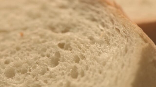Slices of white bread on turning plate, close up