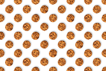 Chocolate chip cookie pattern on a white background. Lots of brown baked cookies, filled with...