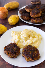 German meatballs called Frikadellen served with potato salad