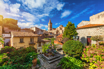 Picturesque street with the Duomo in the background in Novara di Sicilia, Sicily, Italy. Amazing cityscape of Novara di Sicilia town. Mountain village Novara di Sicilia, Sicily, Italy.