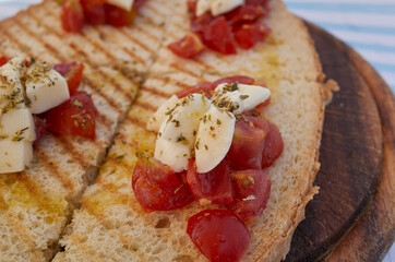 Bruschetta with mozzarella cheese and tomato